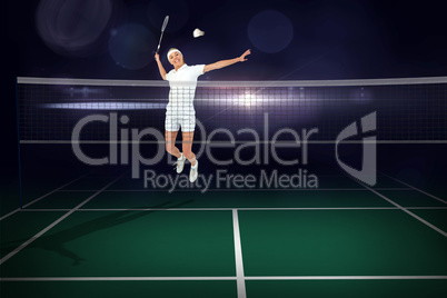 Composite image of badminton player playing badminton