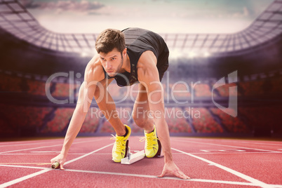 Composite image of sportsman starting to sprint