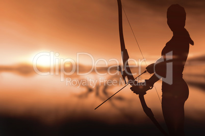 Sportswoman practicing archery