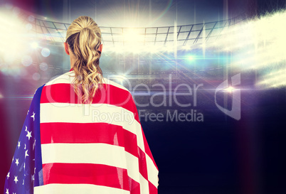 Composite image of athlete with american flag wrapped around his
