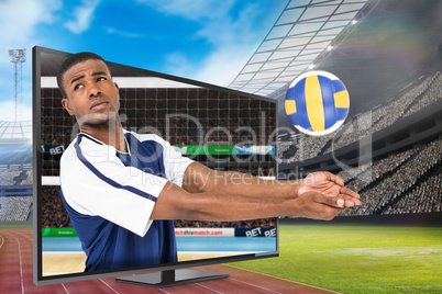 Composite image of sportsman posing while playing volleyball