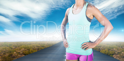 Composite image of fit woman posing and smiling