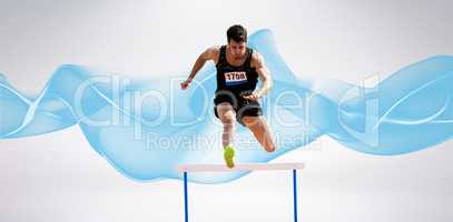 Composite image of sportsman practising hurdles