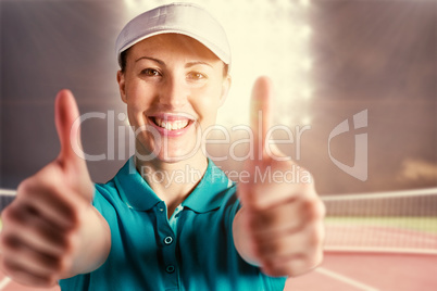 Composite image of sportswoman posing on black background