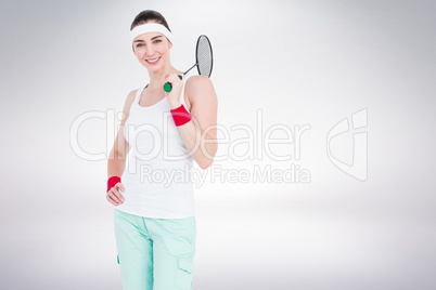 Composite image of badminton player is posing and smiling
