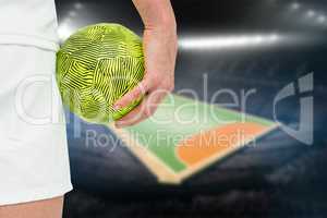 Composite image of sportswoman holding a ball