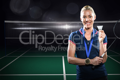 Composite image of badminton player posing with gold medal aroun