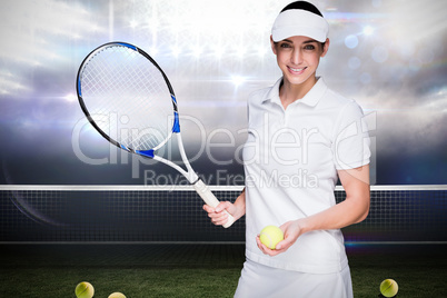 Female athlete posing with a tennis racket