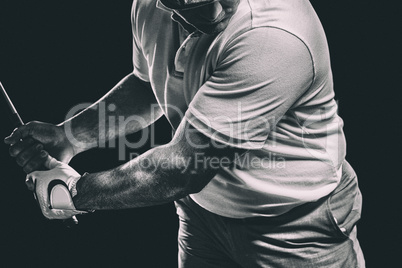 Composite image of portrait of golf player taking a shot