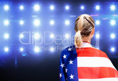 American sportswoman is posing against composite image of blue s