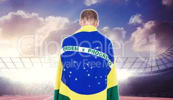 Composite image of athlete with brazilian flag wrapped around hi