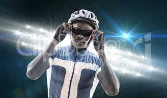 Composite image of cyclist is posing
