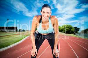 Composite image of sportswoman posing his hands on knee