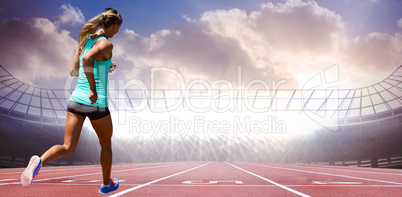 Composite image of rear view of sportswoman running on a white b