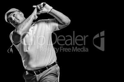 Portrait of golf player taking a shot