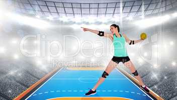 Female athlete with elbow pad throwing handball