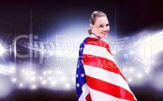 Portrait of happy american sportswoman posing  against american