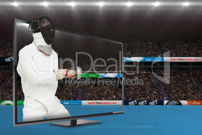 Composite image of man wearing fencing suit practicing with swor