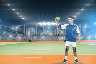 Composite image of sportsman posing with ball on white backgroun