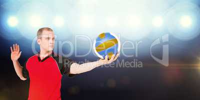 Composite image of sportsman getting ready to serve while playin