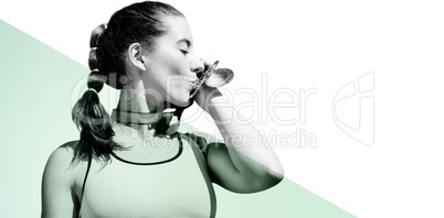 Composite image of sportswoman kissing her medals