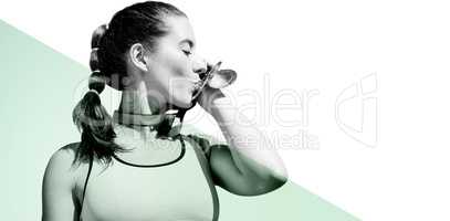 Composite image of sportswoman kissing her medals