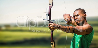 Composite image of close up view of man practicing archery