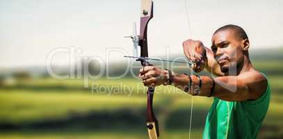 Composite image of close up view of man practicing archery