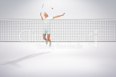 Composite image of badminton player playing badminton