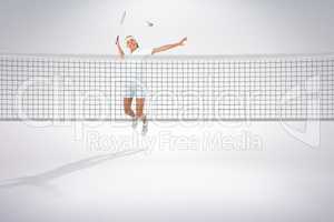 Composite image of badminton player playing badminton