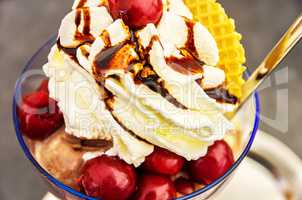 SUNDAE WITH CHERRIES AND WHIPPED CREAM