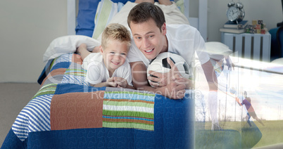 Composite image of father and son are watching sport on televisi