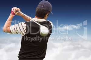 Rear view of man playing golf