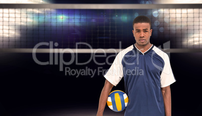 Composite image of sportsman holding a volleyball