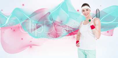 Composite image of badminton player is posing and smiling