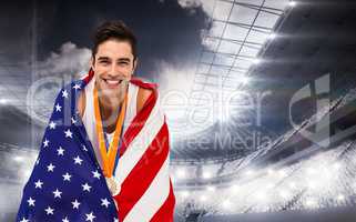 Composite image of athlete holding gold medals and american flag