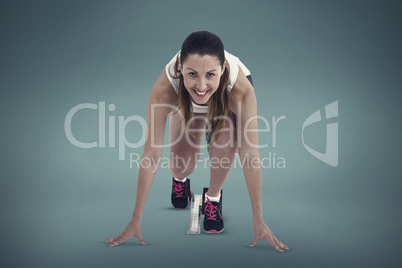 Composite image of athlete woman in ready to run position