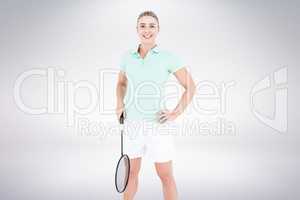 Composite image of badminton player is posing and smiling