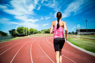 Composite image of rear view of woman running against white back
