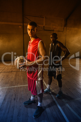 Portrait of two basketball players posing