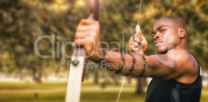 Composite image of front view of sportsman practising archery