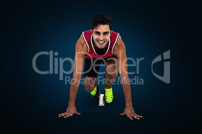 Composite image of athlete man in ready to run position