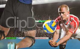 Composite image of sportsmen are playing volleyball