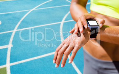 Composite image of close up on a sportswoman wearing a connected