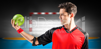 Composite image of confident athlete man holding a ball