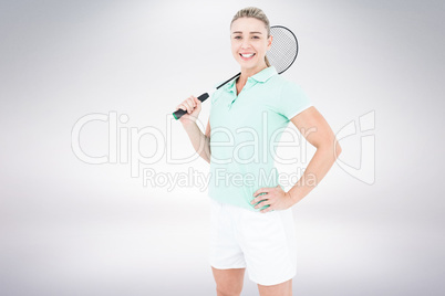 Composite image of badminton player is posing and smiling