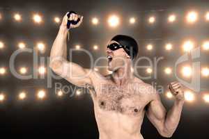 Composite image of swimmer posing with gold medal
