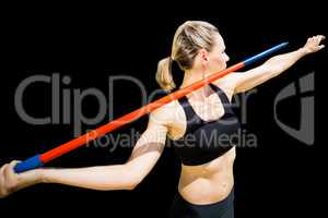 Composite image of sportswoman preparing to javelin throw