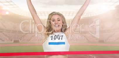 Composite image of portrait of cheerful winner athlete crossing