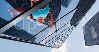 Composite image of low angle female athlete jumping